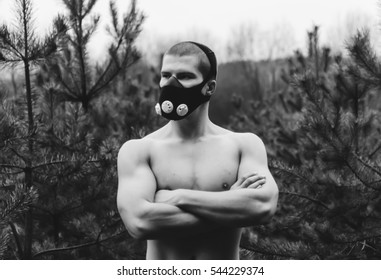 Man Wearing High Altitude Mask Fitness Training. Black And White Photo
