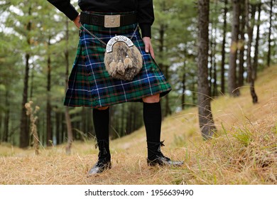 Man Wearing High Fashion Tartan Kilt With Sporran | Nature, Green, Red, Blue High-Quality Stock Image