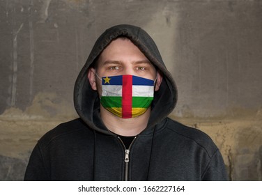 Man Wearing a hood and a Central African Republic flag Mask to Protect him virus.