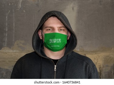 Man Wearing A Hood And Saudi Arabia Flag Mask To Protect Him Virus.