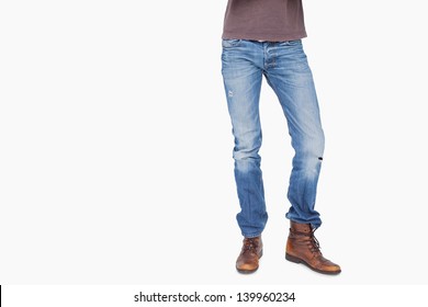 Man Wearing Jeans And Boots On White Background