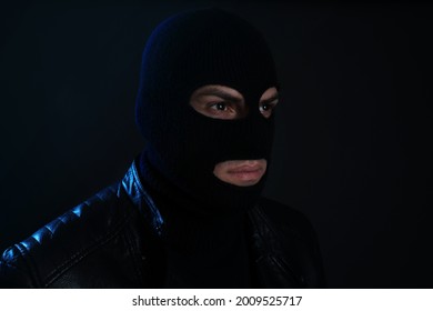 Man Wearing Knitted Balaclava On Black Background