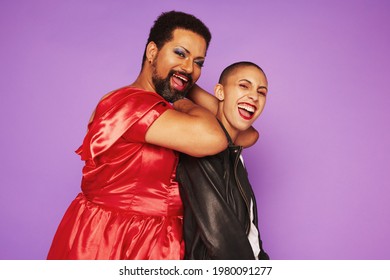 Man Wearing Makeup In A Dress And Female Dressed As A Tomboy.