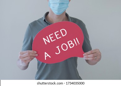 Man Wearing Mask Holding Sign NEED A JOB, Job Loss During Covid-19 Coronavirus Pandemic, Unemployment Economic Recession Concept