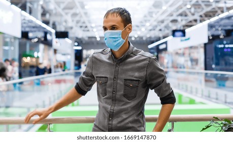 Man wearing mask for protect Novel Coronavirus:2019 or PM 2.5 dust and serious of the air pollution in department store. - Powered by Shutterstock