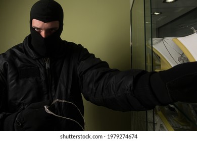 Man Wearing A Mask Robbed A Jewelry Store - Robbery Concept
