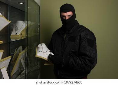 Man Wearing A Mask Robbed A Jewelry Store - Robbery Concept
