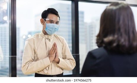 Man Wearing Medical Mask And Face Shield Protect Against Airborne Disease Visitor Greeting Wai Thai Greetings Is A Form Of Thai Culture Instead Of Handshake For Prevent Infection Coronavirus Covid 19.