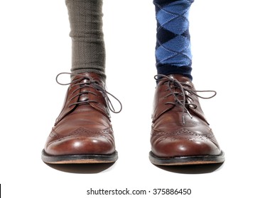 Man Wearing Mismatched Dress Socks