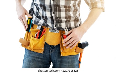 Man wearing mounting belt with tools for repair isolated on white background. Professional equipment of handyman - Shutterstock ID 2207118825