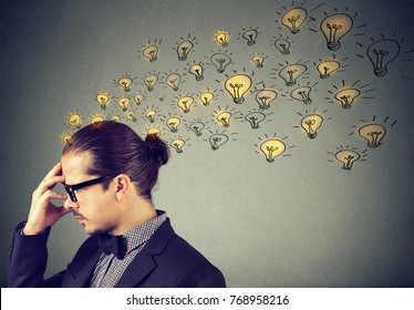 Man wearing nerdy glasses having many ideas thinking organizing thoughts  - Shutterstock ID 768958216