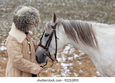 Man Wearing Papakhi And His Horse - Tersk Stallion