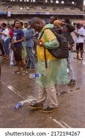A Man Wearing A Rain Coat Seen Kicking A Plastic Bottle At Tafawa Balewa Square In Lagos, NIGERIA, On June 11, 2022.