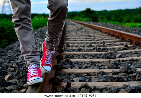 men wearing red shoes