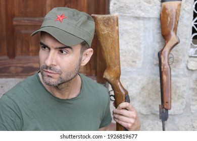 Man Wearing Revolutionary Green Hat With Red Star 