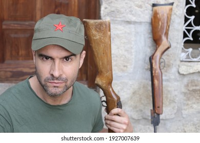 Man Wearing Revolutionary Green Hat With Red Star