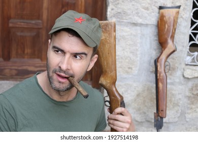 Man Wearing Revolutionary Green Hat With Red Star