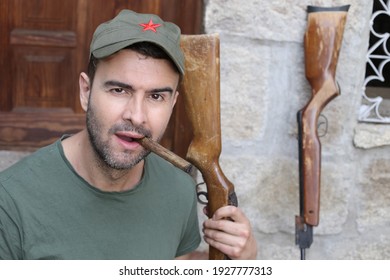 Man Wearing Revolutionary Green Hat With Red Star