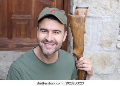 Man Wearing Revolutionary Green Hat With Red Star