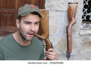 Man Wearing Revolutionary Green Hat With Red Star