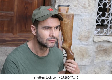 Man Wearing Revolutionary Green Hat With Red Star