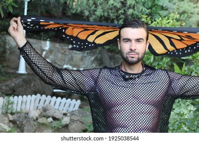 Man Wearing See Through Mesh Shirt And Butterfly Wings