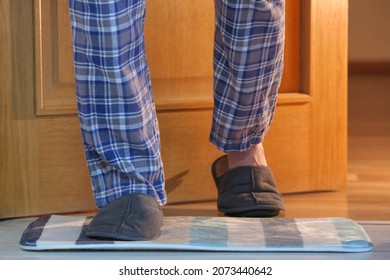 Man wearing soft slippers at home, closeup - Powered by Shutterstock