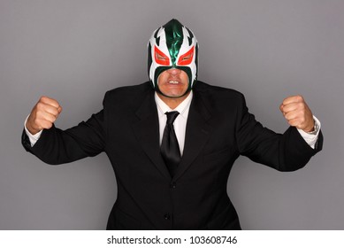 Man Wearing A Suit And Luchador Mask.