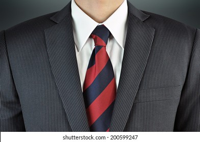 A Man Wearing Suit With Stripe Necktie - Business Attire