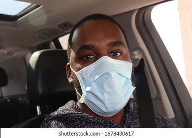 Man Wearing Surgical Mask In Car