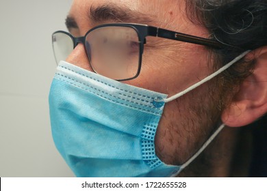 Man Wearing Surgical Mask And Fogged Glasses