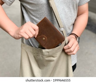 Man Wearing Tote bag with Notebook - Powered by Shutterstock