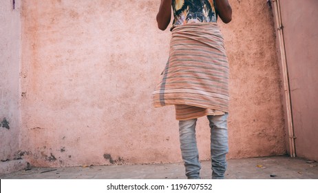 Man Wearing Towel On Top Of Pants