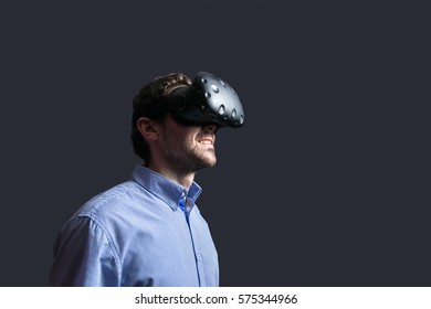 Man Wearing Virtual Reality Goggles. Low Key Photo