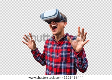 Man wearing virtual reality goggles. Studio shot, transparent background with contur inside