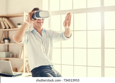 Man wearing virtual reality headset modern technology - Powered by Shutterstock