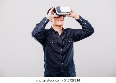 Man Wearing Virtual Reality Using A VR Headset On White Background