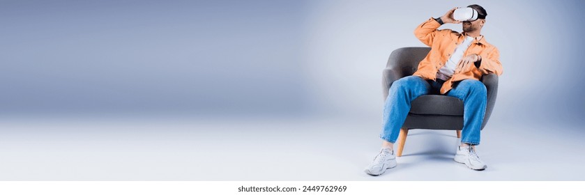 A man wearing a VR headset sits in a chair with his head in his hands, lost in deep thought in a studio setting. - Powered by Shutterstock