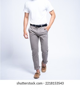 Man wearing white basic t shirt and grey chino pants catalogue