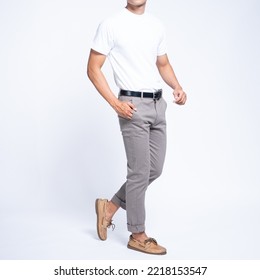 Man wearing white basic t shirt and grey chino pants catalogue