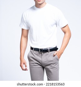 Man wearing white basic t shirt and grey chino pants catalogue