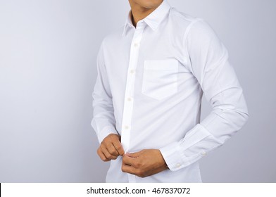 A Man Wearing A White Shirt. White Background.