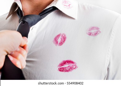 Man Wearing White Shirt Covered By Red Lipstick Kisses