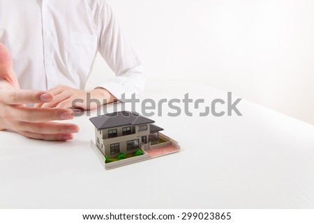 Man wearing a white shirt that are designing a house