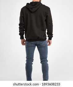 Man Wears Black Hoodie. Isolated Clothing Mockup Photo