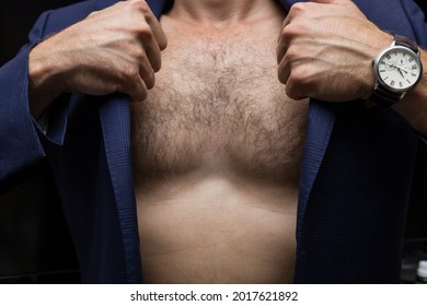 A Man Wears A Blue Jacket On His Naked Body, A Watch On His Arm, A Hairy Male Chest