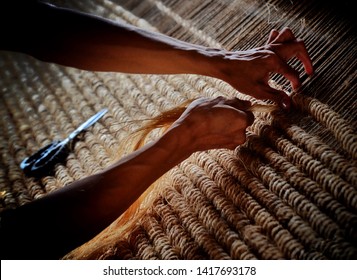 Man weaving abaca fibers in Albay