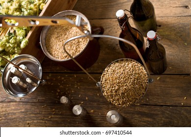 Man Weighs Malt For Home Brewing Of Beer.  Top View.