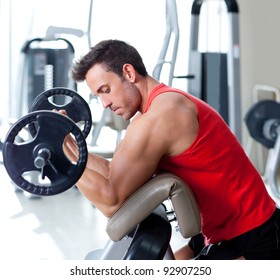 man with weight training equipment on sport gym club
