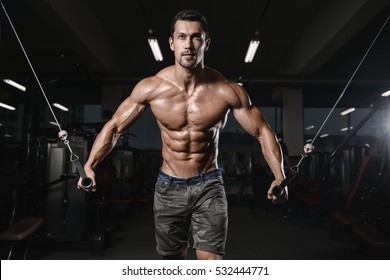 Man With Weight Training In Gym Equipment Sport Club